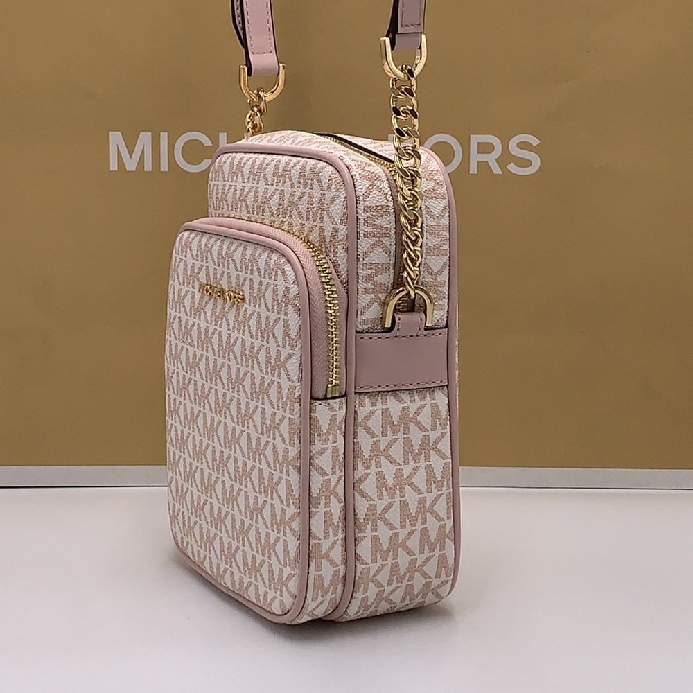 MICHAEL KORS
Jet Set Travel Md Signature Logo Crossbody
OPTIC WHITE/RS GOLD
NWT - Picture 10 of 16
